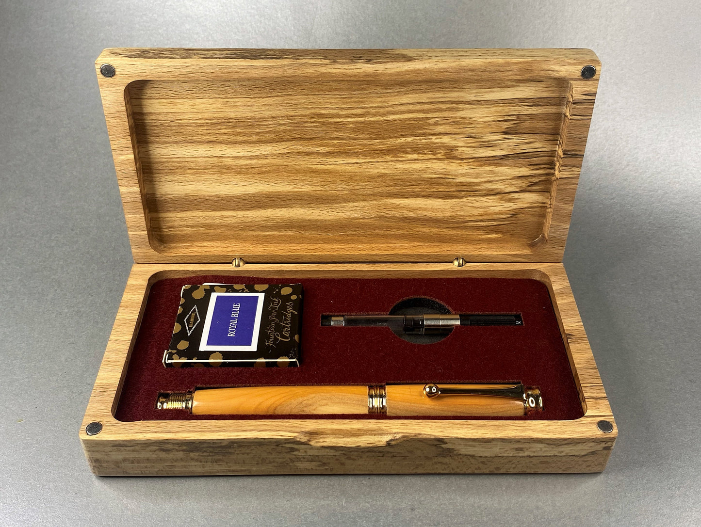 Open lidded Spalted Beech wood box showing the hand turned Fountain pen made in English Yew wood with Gold plated fittings