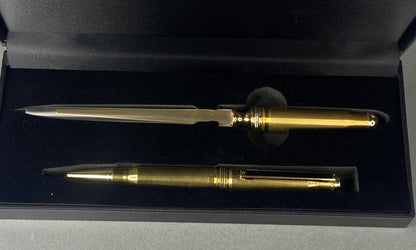 Open lidded black card box with a pen and a letter opener made from once fired .308 brass shell cases