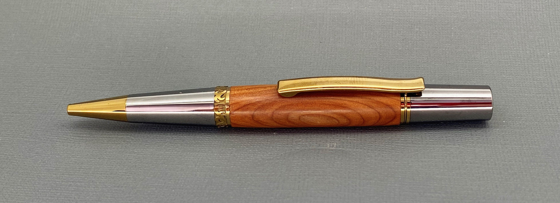 Handturned English Yew wood pen with gold and chrome plated fittings