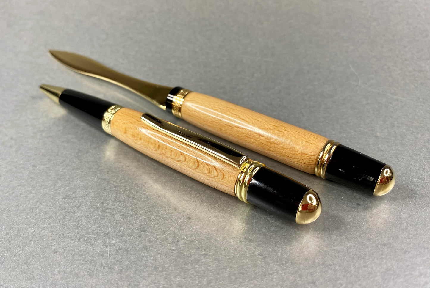 One hand crafted and turned pen and one Letter opener made from Beech wood and  both have Gold Plated fittings