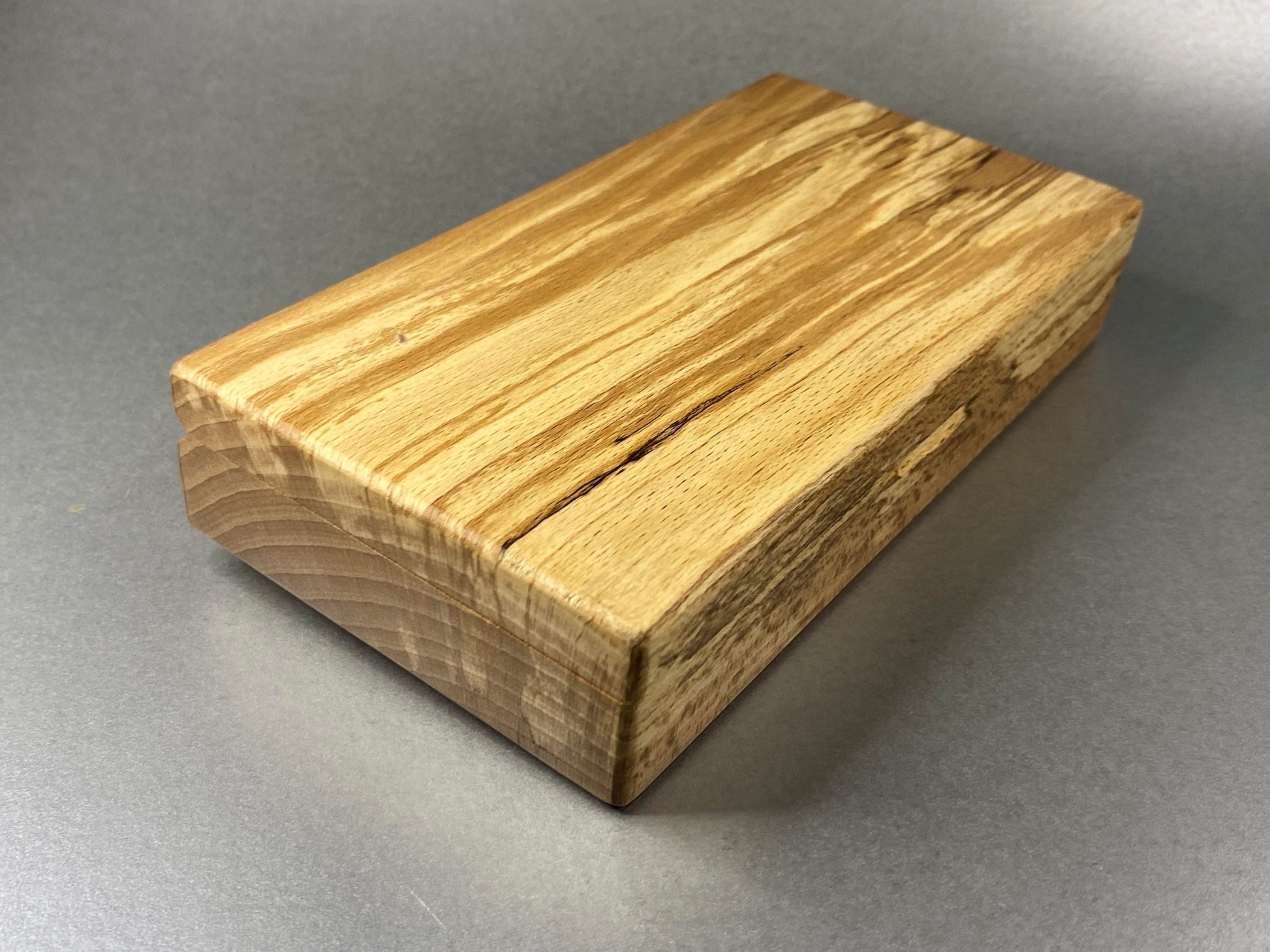 Open lidded Spalted Beech wood box showing all its fine looking grain effects in the end grain and the lid